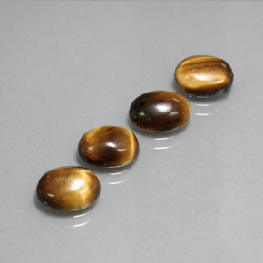 Gemas de tiger's eye marrón natural de  ct, corte óvalo, opaco