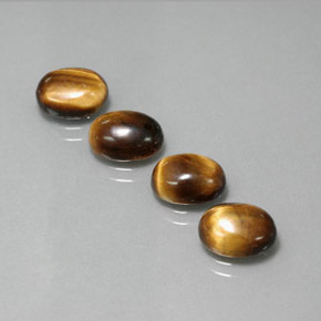Gemas de tiger's eye marrón natural de  ct, corte óvalo, opaco