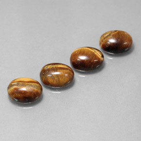 Gemas de tiger's eye marrón natural de  ct, corte óvalo, opaco