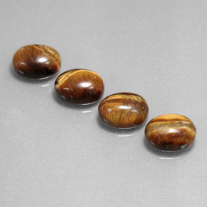 Gemas de tiger's eye marrón natural de  ct, corte óvalo, opaco