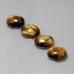 Gemas de tiger's eye marrón natural de  ct, corte óvalo, opaco