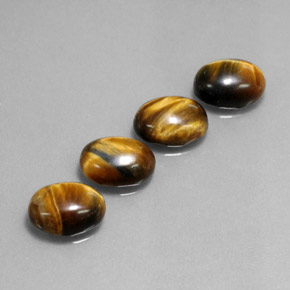 Gemas de tiger's eye marrón natural de  ct, corte óvalo, opaco