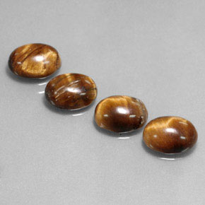 Gemas de tiger's eye marrón natural de  ct, corte óvalo, opaco