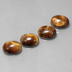 Gemas de tiger's eye marrón natural de  ct, corte óvalo, opaco