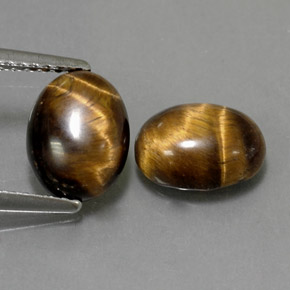 Gemas de tiger's eye marrón natural de  ct, corte óvalo, opaco