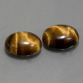 Gemas de tiger's eye marrón natural de  ct, corte óvalo, opaco
