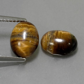Gemas de tiger's eye marrón natural de  ct, corte óvalo, opaco
