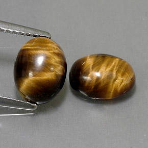 Gemas de tiger's eye marrón natural de  ct, corte óvalo, opaco