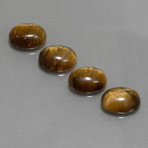 Gemas de tiger's eye marrón natural de  ct, corte óvalo, opaco