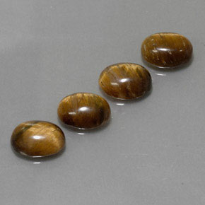 Gemas de tiger's eye marrón natural de  ct, corte óvalo, opaco