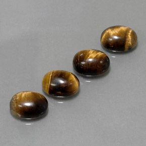 Gemas de tiger's eye marrón natural de  ct, corte óvalo, opaco