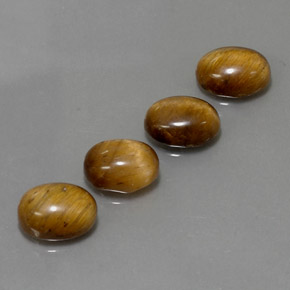 Gemas de tiger's eye marrón natural de  ct, corte óvalo, opaco