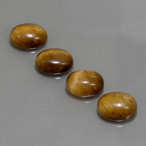 Gemas de tiger's eye marrón natural de  ct, corte óvalo, opaco