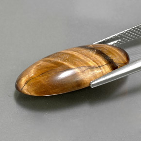 Tiger's eye marrón natural de 11,79 ct, corte óvalo, opaco