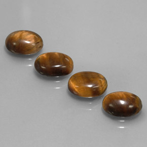 Gemas de tiger's eye marrón natural de  ct, corte óvalo, opaco
