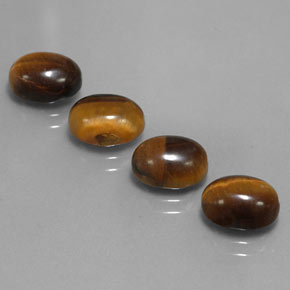 Gemas de tiger's eye marrón natural de  ct, corte óvalo, opaco