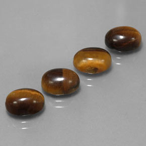 Gemas de tiger's eye marrón natural de  ct, corte óvalo, opaco