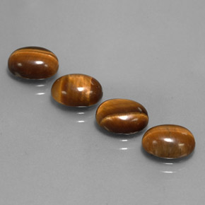 Gemas de tiger's eye marrón natural de  ct, corte óvalo, opaco