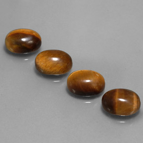 Gemas de tiger's eye marrón natural de  ct, corte óvalo, opaco
