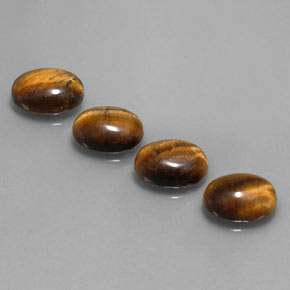 Gemas de tiger's eye marrón natural de  ct, corte óvalo, opaco