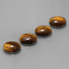 Gemas de tiger's eye marrón natural de  ct, corte óvalo, opaco