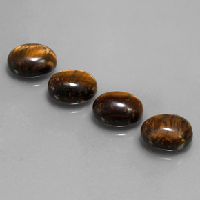 Gemas de tiger's eye marrón natural de  ct, corte óvalo, opaco