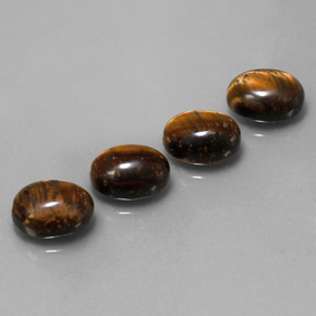 Gemas de tiger's eye marrón natural de  ct, corte óvalo, opaco