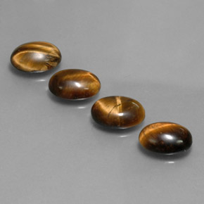 Gemas de tiger's eye marrón natural de  ct, corte óvalo, opaco