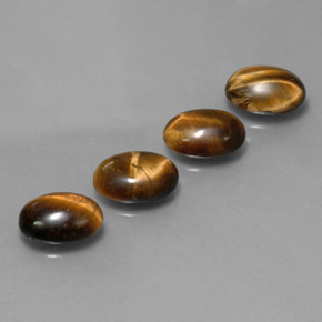 Gemas de tiger's eye marrón natural de  ct, corte óvalo, opaco