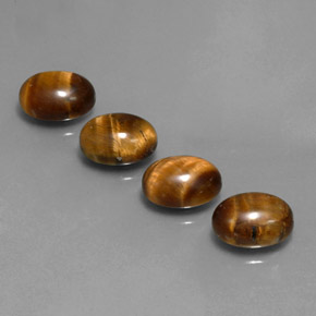 Gemas de tiger's eye marrón natural de  ct, corte óvalo, opaco