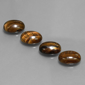 Gemas de tiger's eye marrón natural de  ct, corte óvalo, opaco