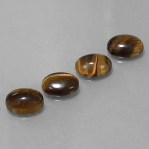 Gemas de tiger's eye marrón natural de  ct, corte óvalo, opaco