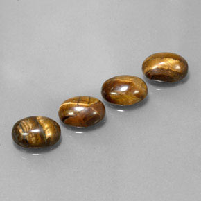 Gemas de tiger's eye marrón natural de  ct, corte óvalo, opaco