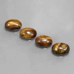 Gemas de tiger's eye marrón natural de  ct, corte óvalo, opaco
