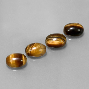 Gemas de tiger's eye marrón natural de  ct, corte óvalo, opaco