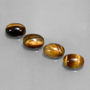 Gemas de tiger's eye marrón natural de  ct, corte óvalo, opaco