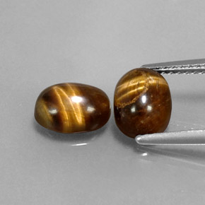 Gemas de tiger's eye marrón natural de  ct, corte óvalo, opaco