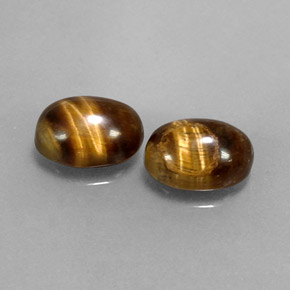 Gemas de tiger's eye marrón natural de  ct, corte óvalo, opaco