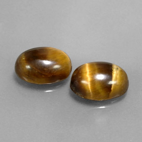 Gemas de tiger's eye marrón natural de  ct, corte óvalo, opaco