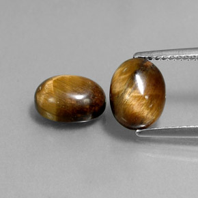 Gemas de tiger's eye marrón natural de  ct, corte óvalo, opaco
