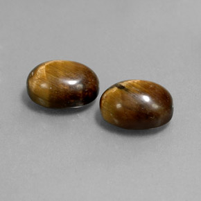 Gemas de tiger's eye marrón natural de  ct, corte óvalo, opaco