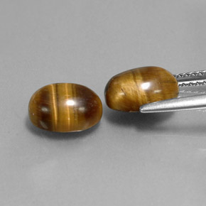 Gemas de tiger's eye marrón natural de  ct, corte óvalo, opaco