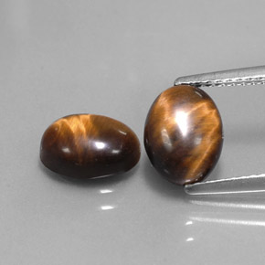 Gemas de tiger's eye marrón natural de  ct, corte óvalo, opaco