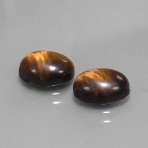 Gemas de tiger's eye marrón natural de  ct, corte óvalo, opaco