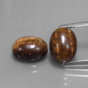 Gemas de tiger's eye marrón natural de  ct, corte óvalo, opaco
