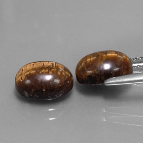 Gemas de tiger's eye marrón natural de  ct, corte óvalo, opaco