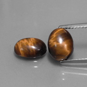 Gemas de tiger's eye marrón natural de  ct, corte óvalo, opaco