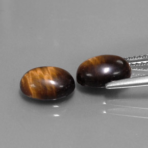 Gemas de tiger's eye marrón natural de  ct, corte óvalo, opaco