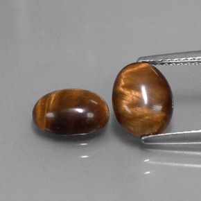 Gemas de tiger's eye marrón natural de  ct, corte óvalo, opaco