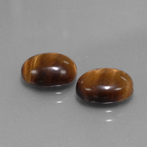 Gemas de tiger's eye marrón natural de  ct, corte óvalo, opaco